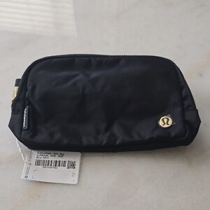 Lululemon Athletica Black Crossbody Bag with Gold Details